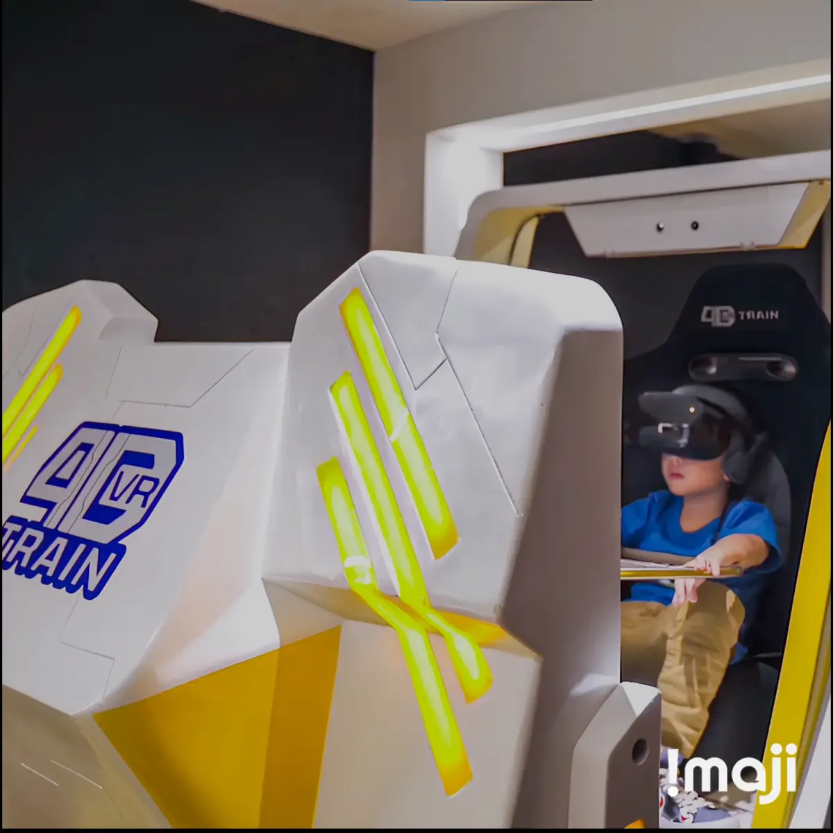 Child wearing a VR headset on a 4D VR Train ride seat at the Garudafood X-Quest activation