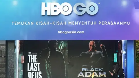 HBO GO themed bus shelter in Jakarta with series and film posters and a QR code on the side panel